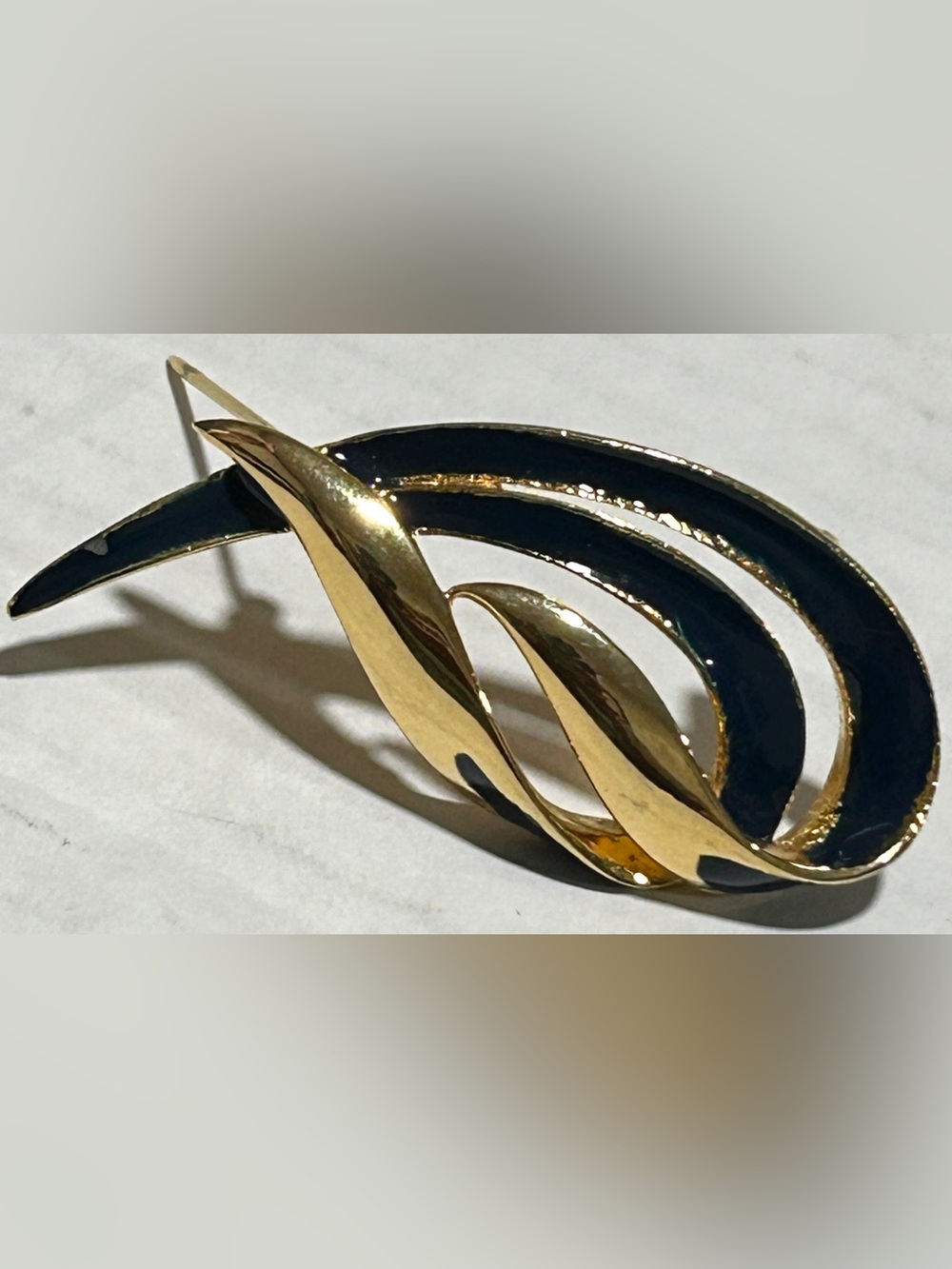 Gold-Tone Brooch with Black Enamel Wave Design